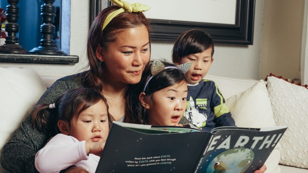 Mom reading with her children