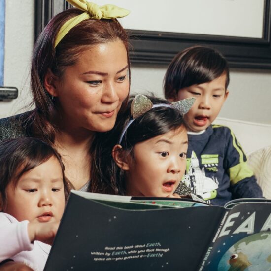 Mom reading with her children
